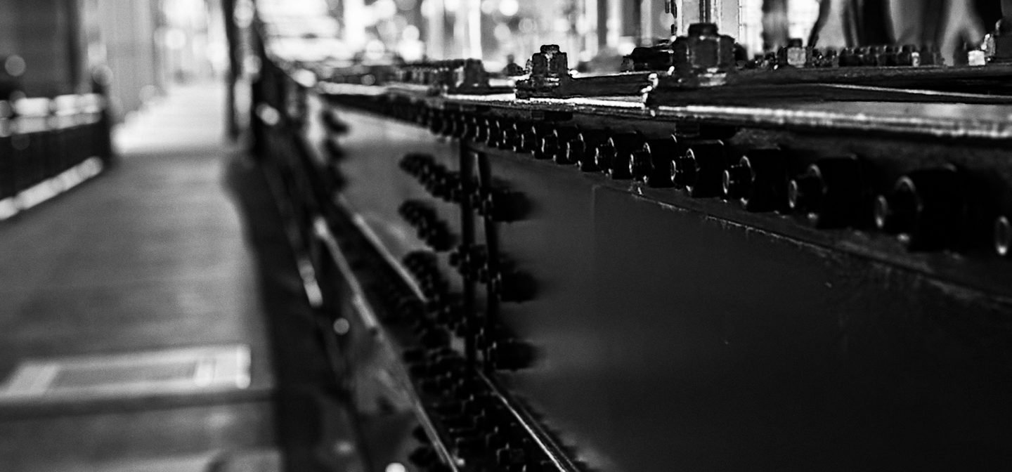 Black and white close-up of the rivets along a Chicago bridge