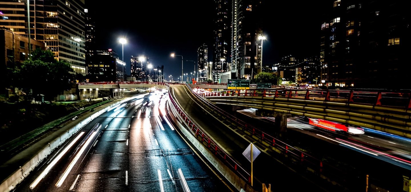 Long exposure of light trails through a Chicago highway interchange at night