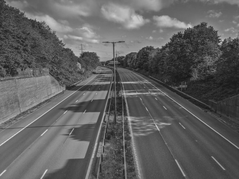 Black and white photograph of a completely empty motorway, Birmingham lockdown 2020