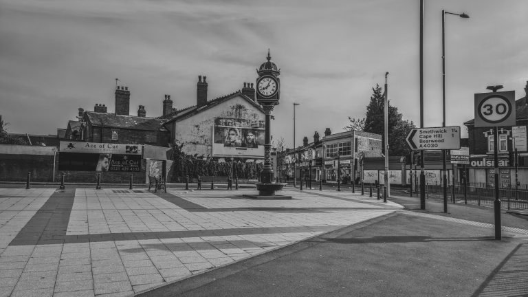 Black and white photograph of the clock tower square in Bearwood, deserted, Birmingham lockdown 2020