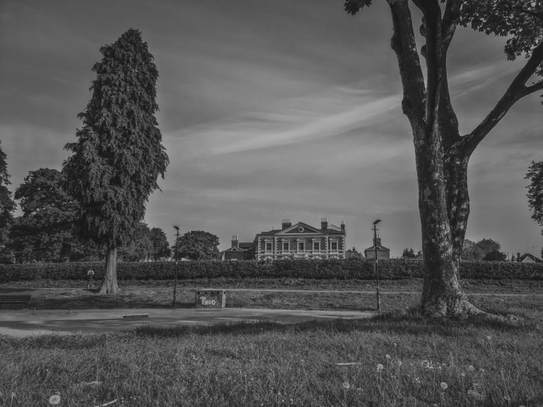 Black and white photograph of a grand house across an empty park, Birmingham lockdown 2020