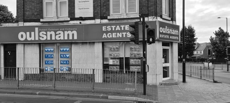 An Oulsnam estate agents window spelling Thank You NHS in blue hearts, Bearwood, Birmingham lockdown 2020
