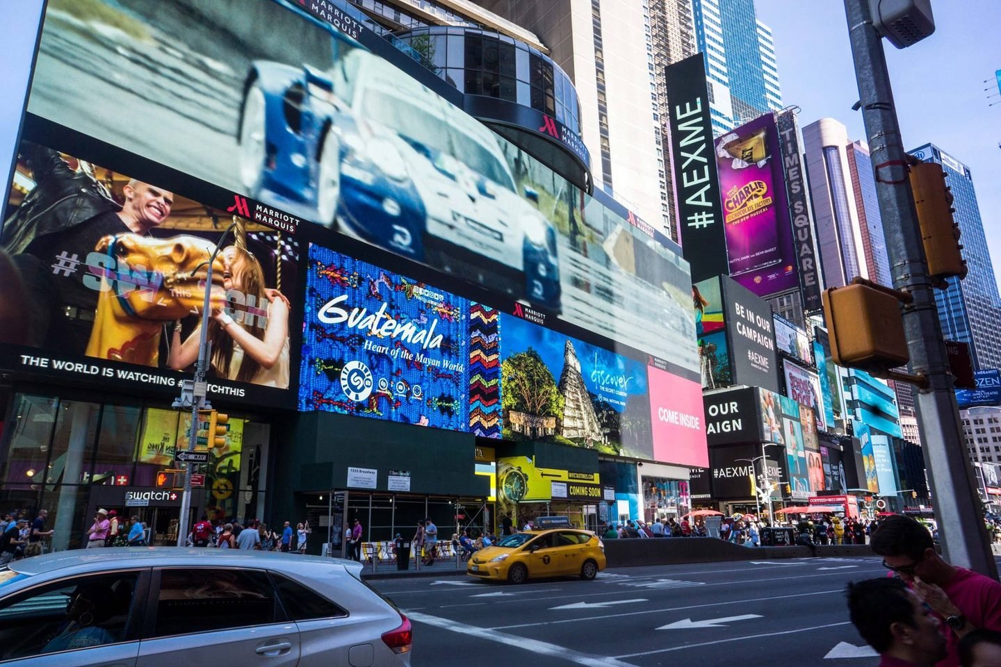 Times Square billboards and yellow cabs in New York