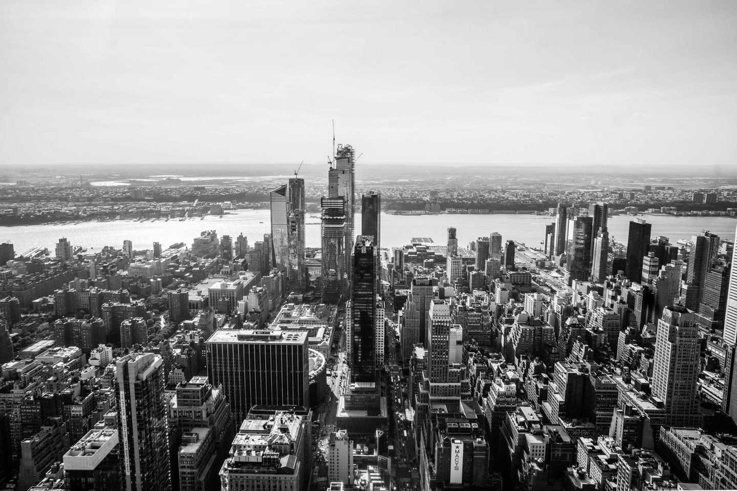 Black and white aerial view of Manhattan towards Hudson Yards and the Hudson River